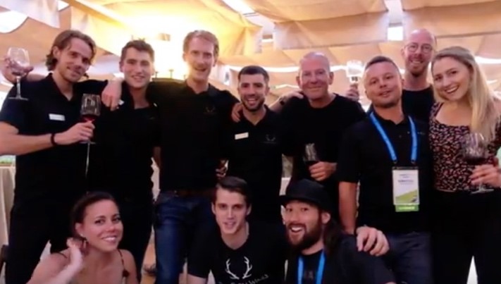 The Dry Farm Wine team poses with wine glasses at Mindshare