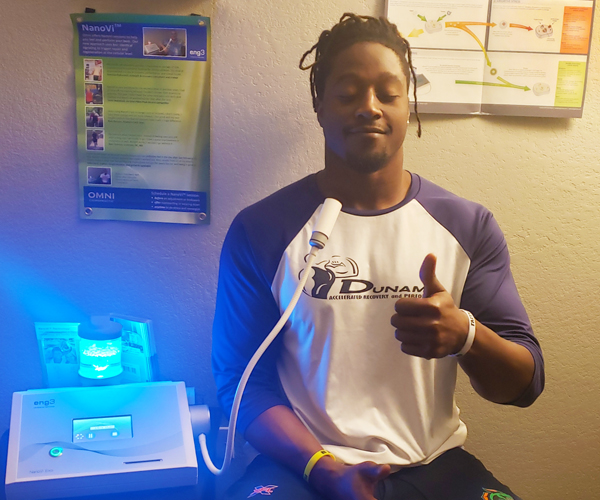 Seattle Dragon Linebacker Steve Johnson gives a thumbs up while using NanoVi